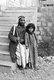 Palestine: A blind Palestinian man with a young girl, possibly his daughter, c. 1910